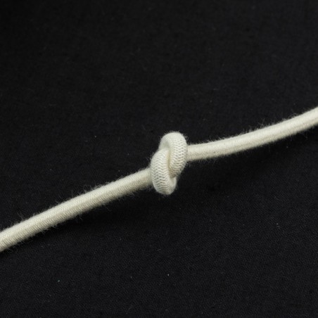 Cordón goma elástica 3.5 mm, redondo, algodón-caucho natural biodegradable color crudo - rollo 100 mts